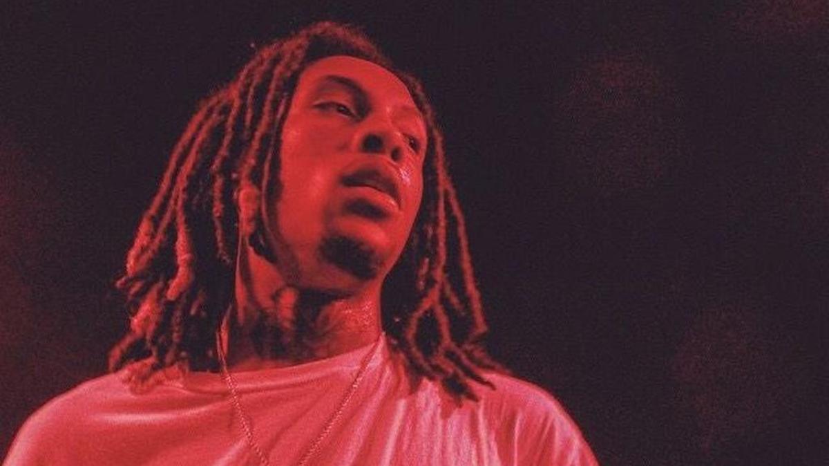 Rapper Chris Travis performs at Strummer’s.