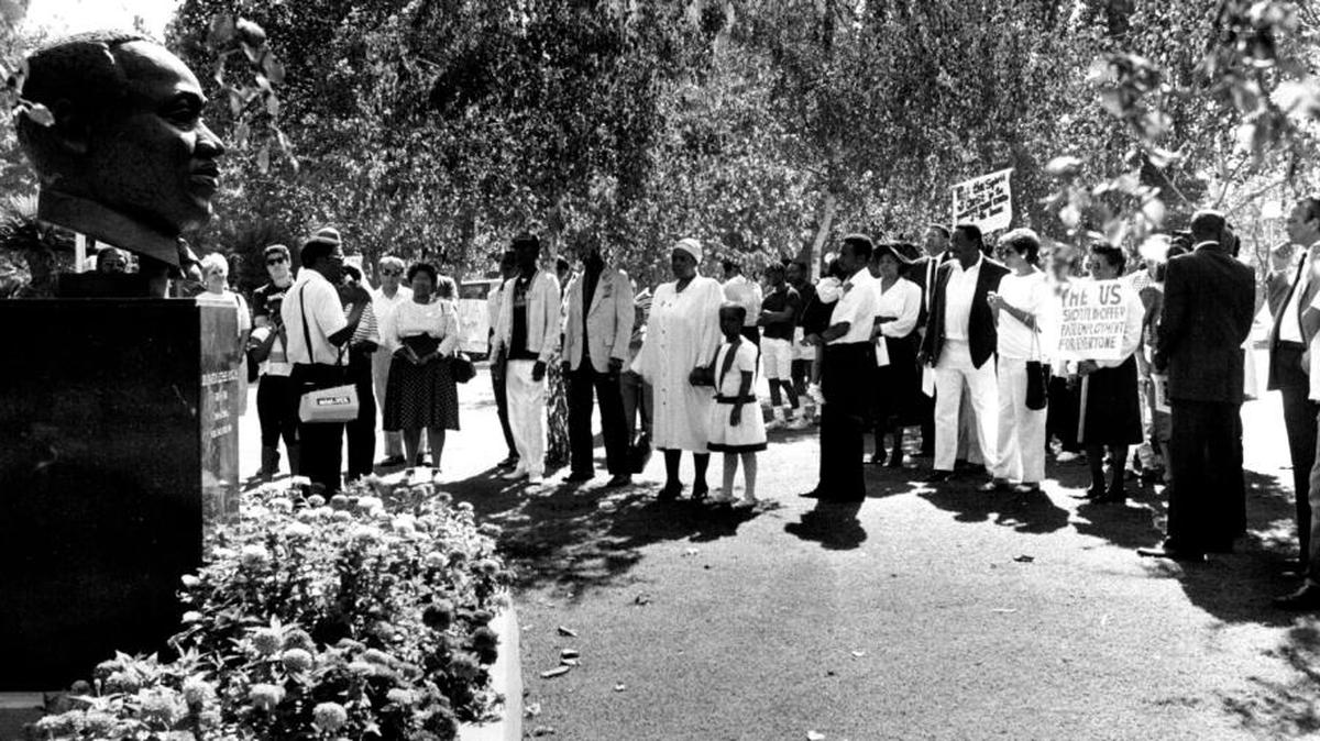 Participants honor Martin Luther King Jr., at Fresno’s Courthouse Park before march.