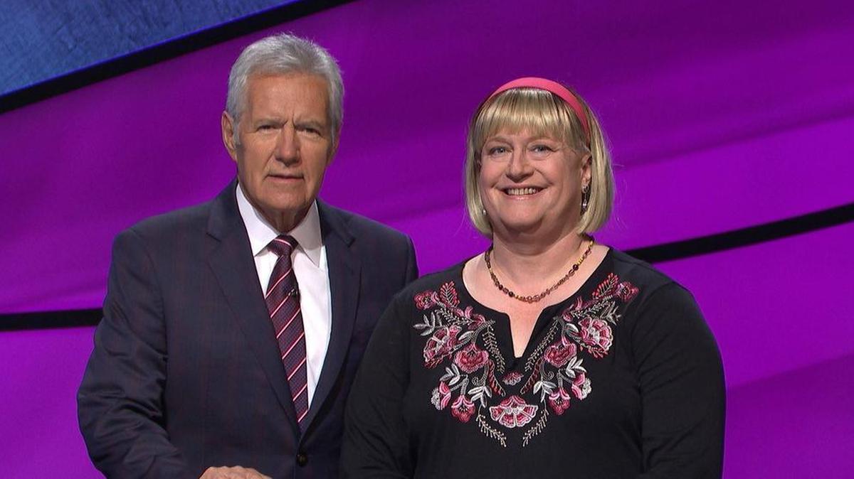 Fran Fried, a former Fresno Bee assistant editor, will appear on “Jeopardy!” on Tuesday, Oct. 17. Fried is believed to be the third transgender person to appear on the popular game show. Fried stands next to the show’s host, Alex Trebek.