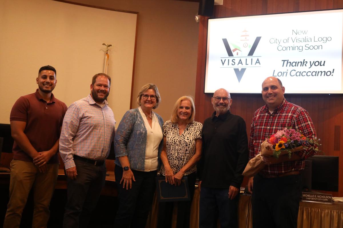 Local artist Lori Caccamo (third from right), the designer behind the City of Visalia’s new logo, received a special recognition Monday night by city council.