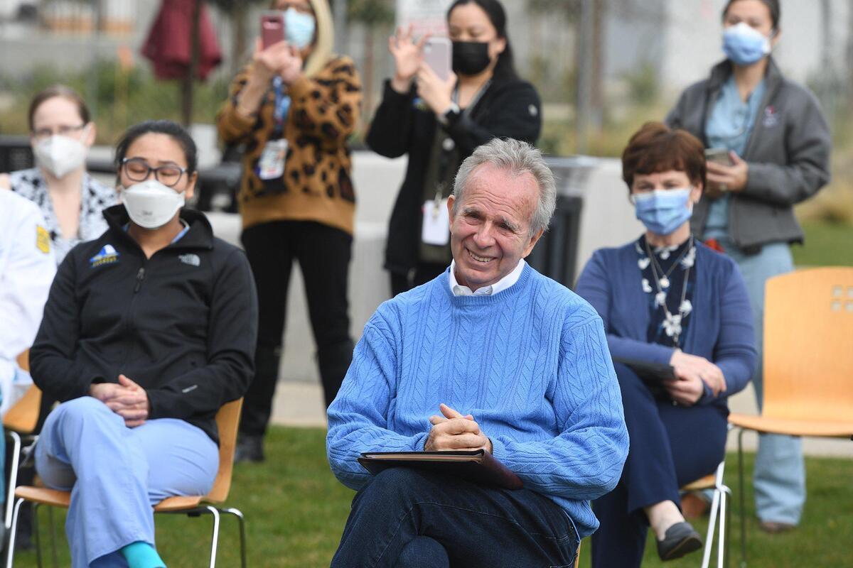 Tony Capozzi sits among Community Regional Medical Center staff, who he credits with saving his life, after they were presented recognition awards Tuesday, Feb. 23, 2021, through the hospital’s Honor Your Care Hero.