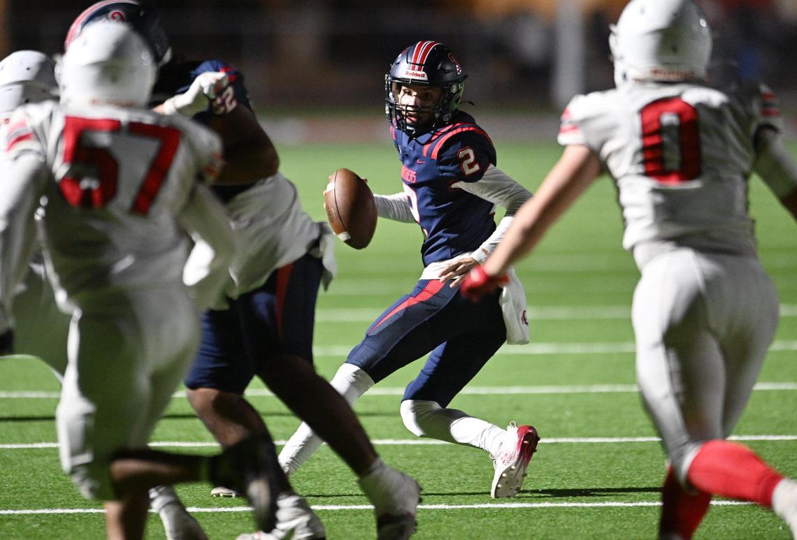 Sanger’s defense pressures San Joaquin Memorial quarterback Colton Johnson, center, Friday, Nov. 1, 2024 in Fresno.