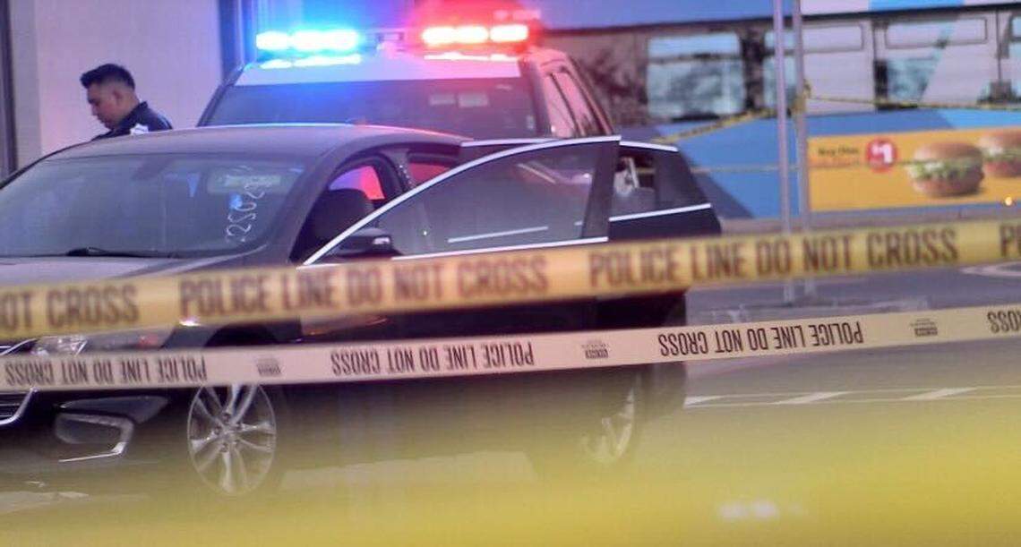 A car possibly involved in a shooting at Shaw and Brawley avenues was surrounded by crime tape on Monday, July 31, 2023.