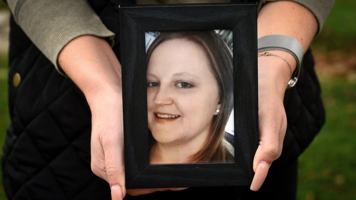 Sarah Rodriguez holds a photo of her cousin Calley Jean Garay, on Dec. 31, 2020. Calley was killed outside a clinic in Madera in July.