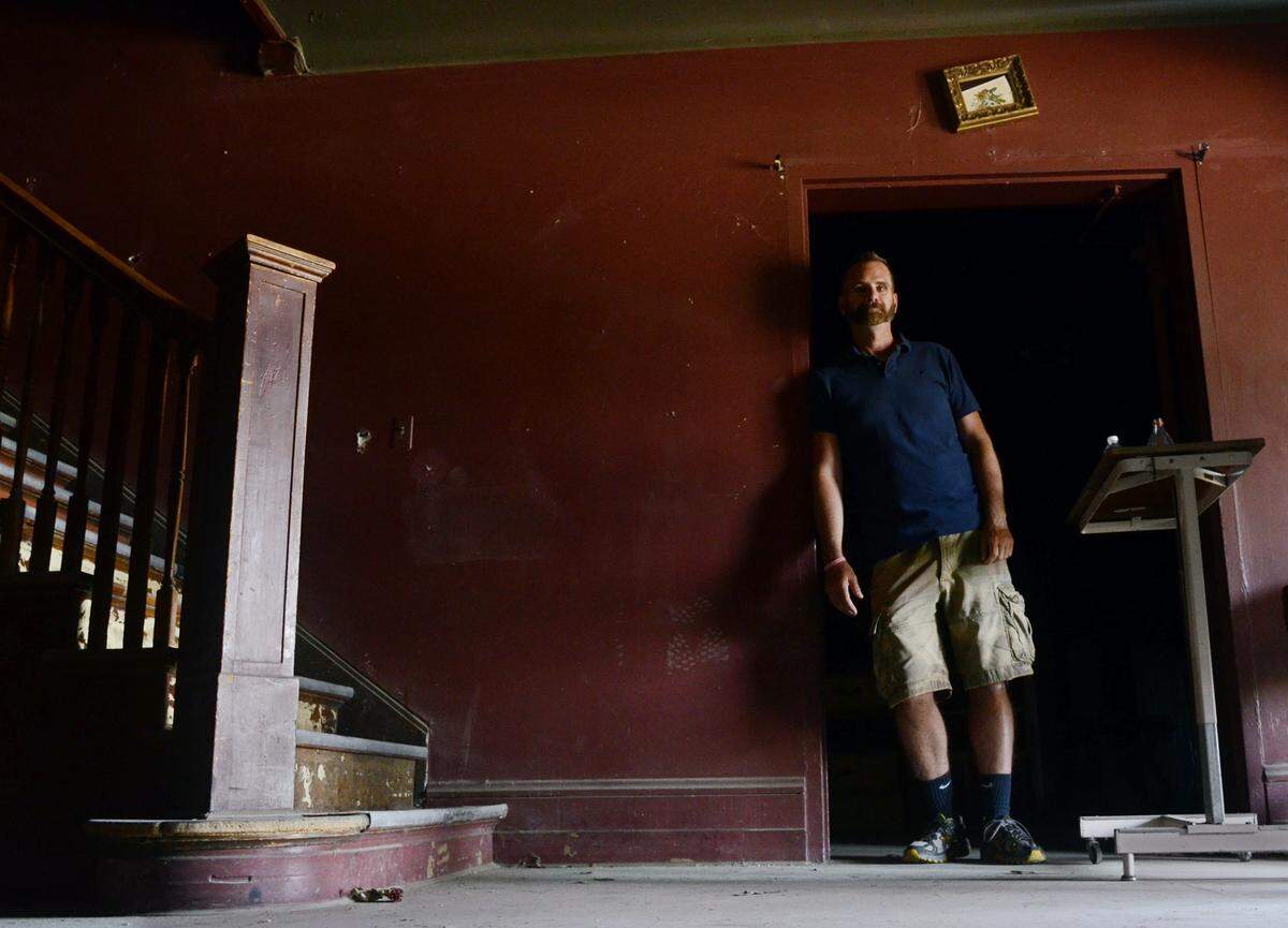 Todd Wolfe stands in Wolfe Manor in Clovis n Thursday, May 15, 2014.