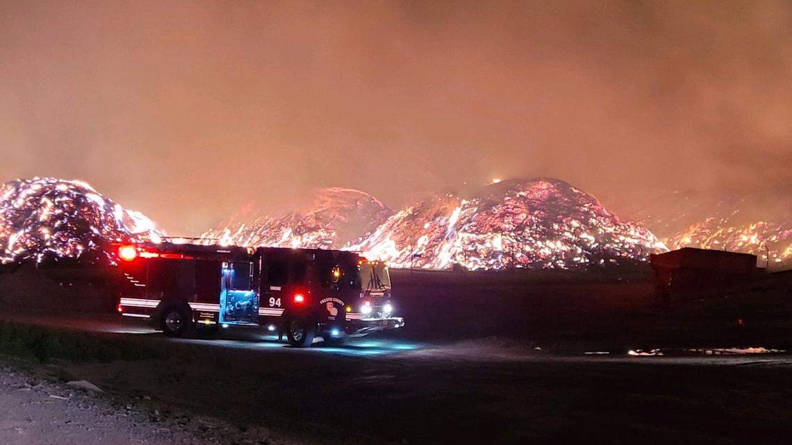 Cal Fire said the almond hull piles will burn for a few more days after a massive fire broke out along Interstate 5 in Fresno County on Feb. 27, 2021.
