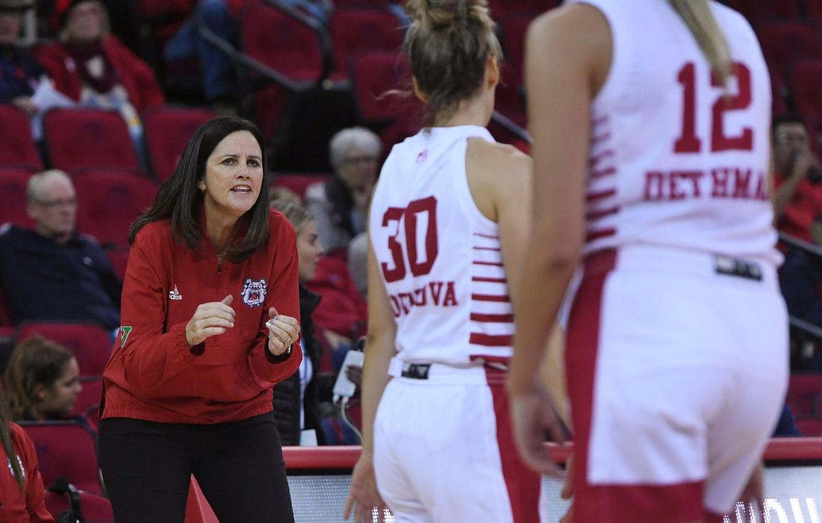Fresno State head coach Jaime White, left. Talks to Yanina Todorova in a timeout against Fresno Pacific Monday, Nov. 7, 2022 in Fresno. The Bulldogs won 66-49.