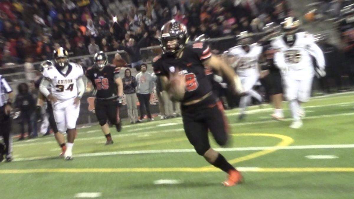 Central High quarterback Trent Tompkins runs for a score in the top-seeded Grizzlies’ 42-21 victory over No. 9 Edison on Friday, Nov. 9, 2018.
