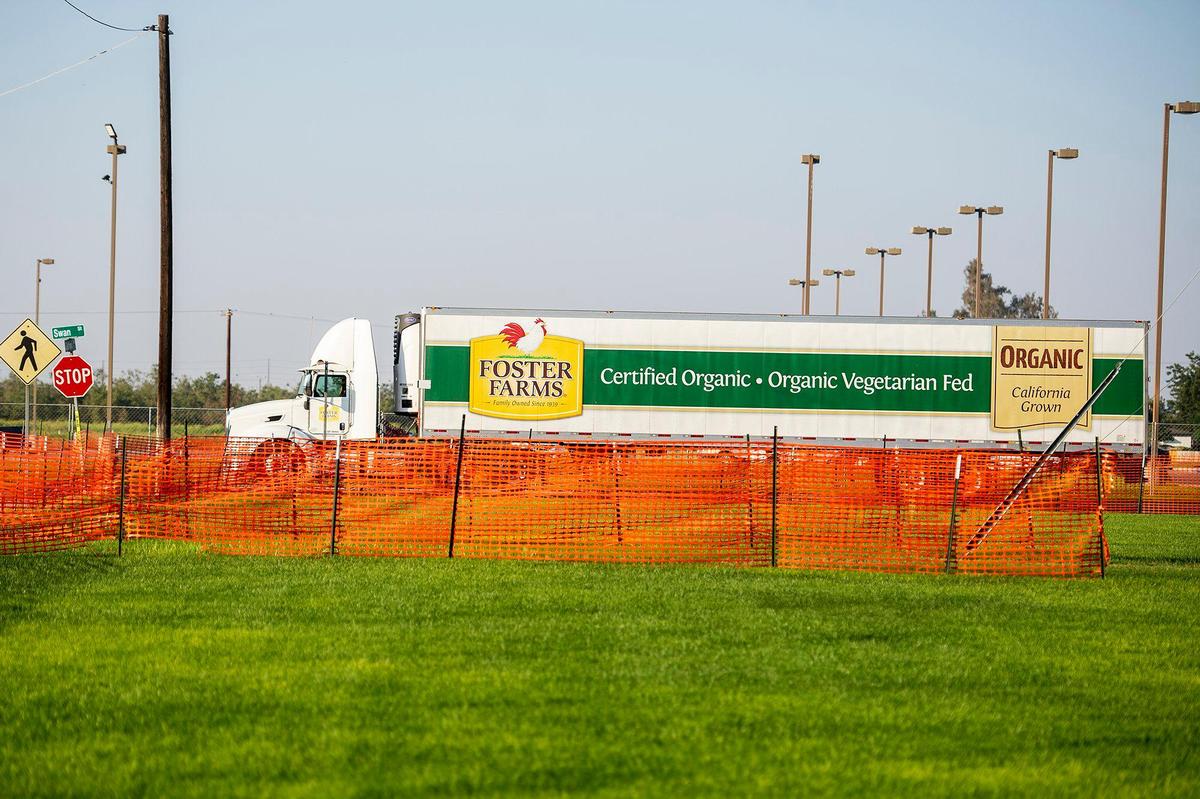 Vehicles including Foster Farms trucks enter and exit the facility located at 1000 Davis Street in Livingston, Calif., on Thursday, Aug. 27, 2020.