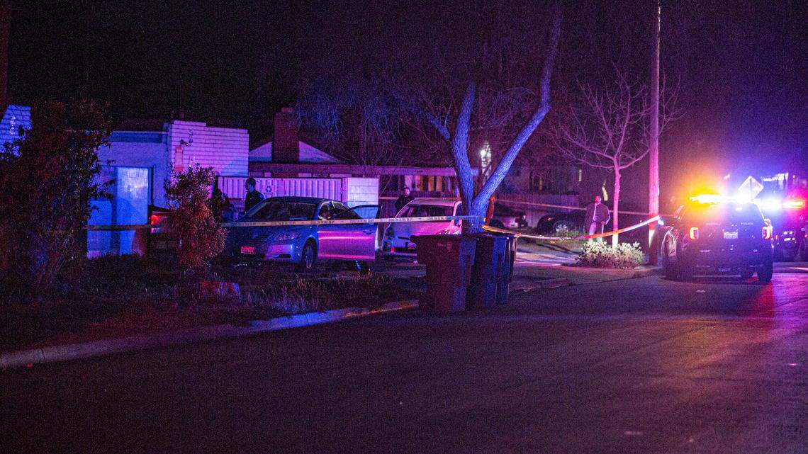 Police tape off sidewalk after a woman was shot in a drive-by shooting near College and Fedora avenues on Thursday, Feb. 24, 2022.