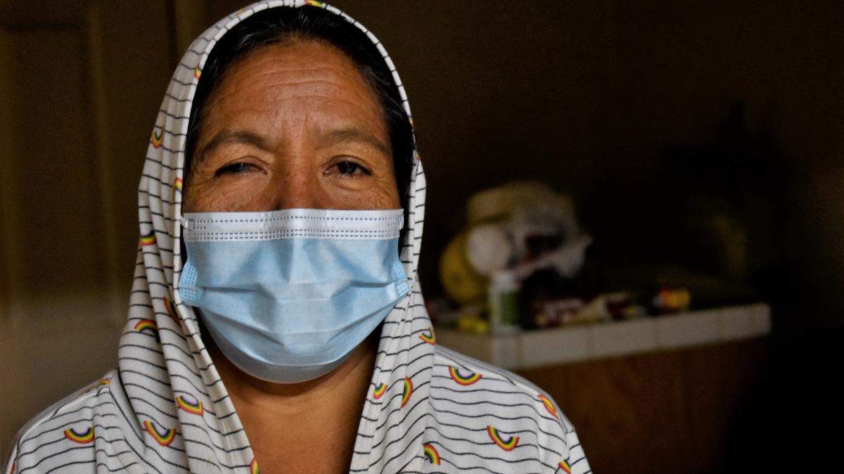 Maria Rios, 59, looks at the camera while in her Madera home on Wednesday, Jan. 18, 2023. She had to stop working in the fields because of a fractured foot, diabetes and kidney problems. She gets dialysis three times a week to make up for the work her kidneys can’t do, and the pain caused by the procedure made her a recurrent patient at the now-closed Madera Community Hospital.