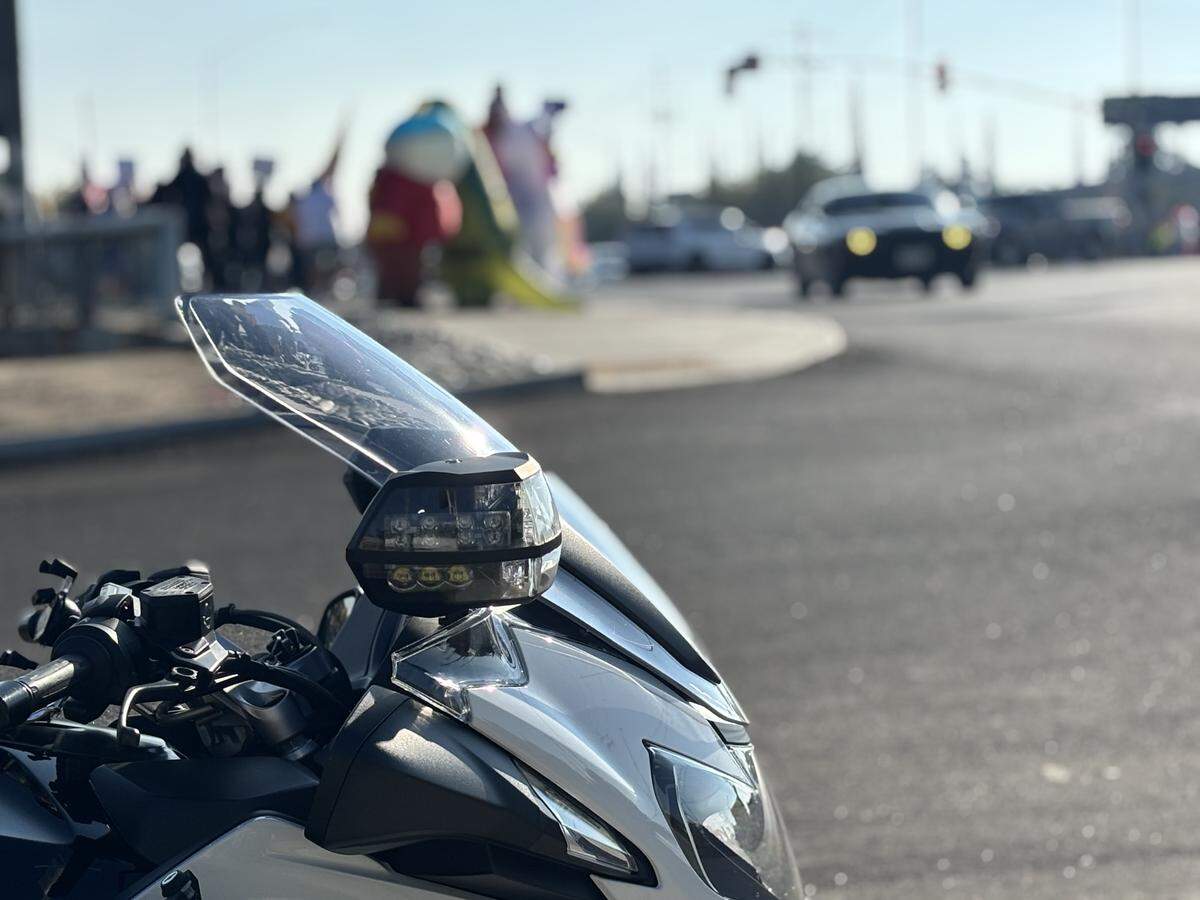 A Fresno police patrol officer watches for traffic at Blackstone and Shields avenues during the ‘No Kings’ demonstration