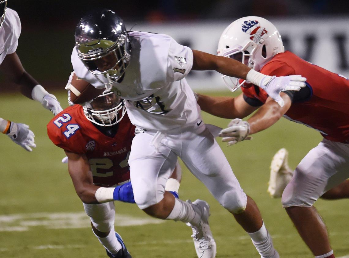 Buchanan’s CJ Jones (24) and teammate Cade Uehling close in for a tackle on Narbonne’s Jared Greenfield during the 2019 season-opener. Jones signed with Fresno State on Wednesday, Dec. 18, 2019, the first day of the national early signing period.