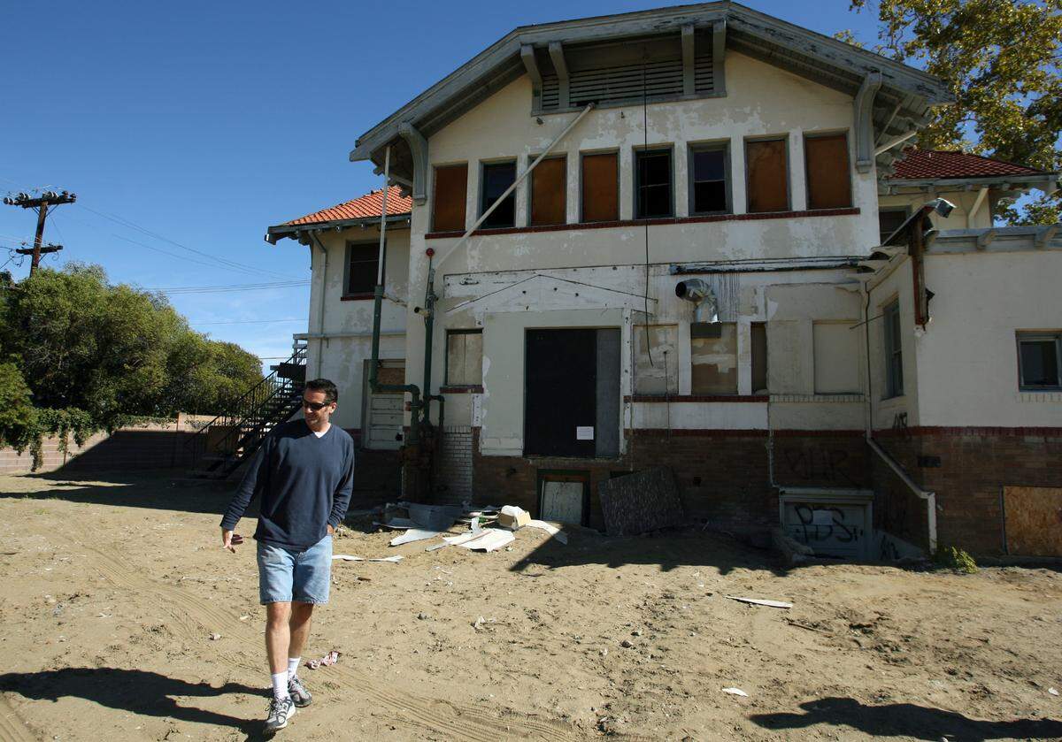 Owner Todd Wolfe walks around behind Wolfe Manor in Clovis on Monday, Oct. 22, 2007.
