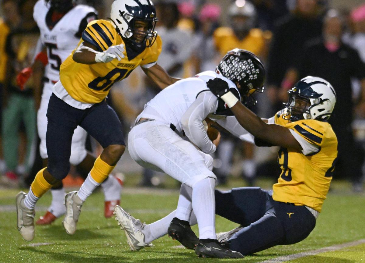 Sunnyside’s Chance Harris, right, sacks McLane quarterback Noah Zamora on Friday, Oct. 20, 2023 in Fresno.