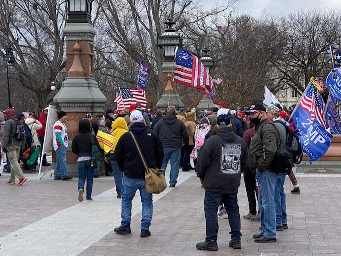 People gather outside the Capitol Wednesday morning, awaiting an address by President Trump.