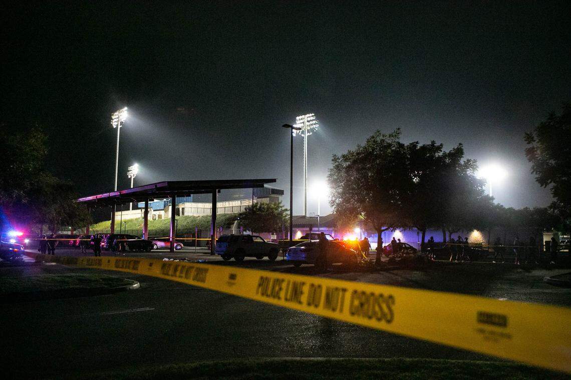 Koligian Stadium parking lot is taped off after six gunshots were fired following a high school football game between Central High and Bullard on Friday Aug. 20, 2021.