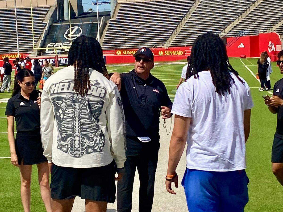 Fresno State football head coach Matt Entz speaks to Arron Mosby after the spring game on Saturday, April 5, 2025.