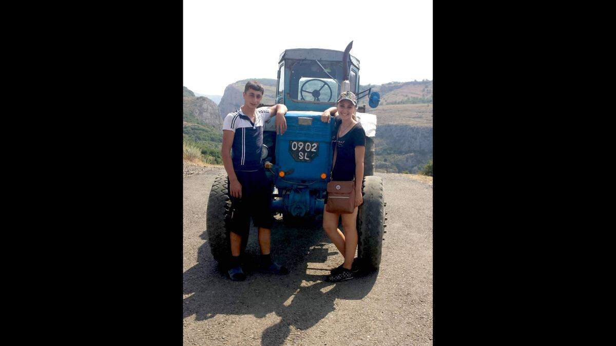 Marine Vardanyan Peters with a villager in Artsakh who taught her how to drive the tractor.