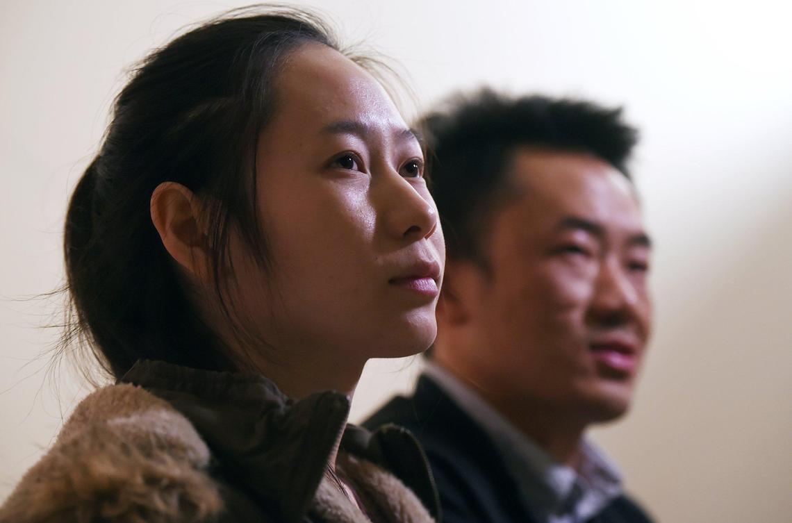 Kaonor Lee, left, and Kou Lee, right, reminisce about their brother musician Xy Lee Tuesday, Nov. 26, 2019 in Fresno. Xy Lee, who had thousands of YouTube followers for his music videos, was killed in a mass shooting Npvember 17, 2019 in Fresno.