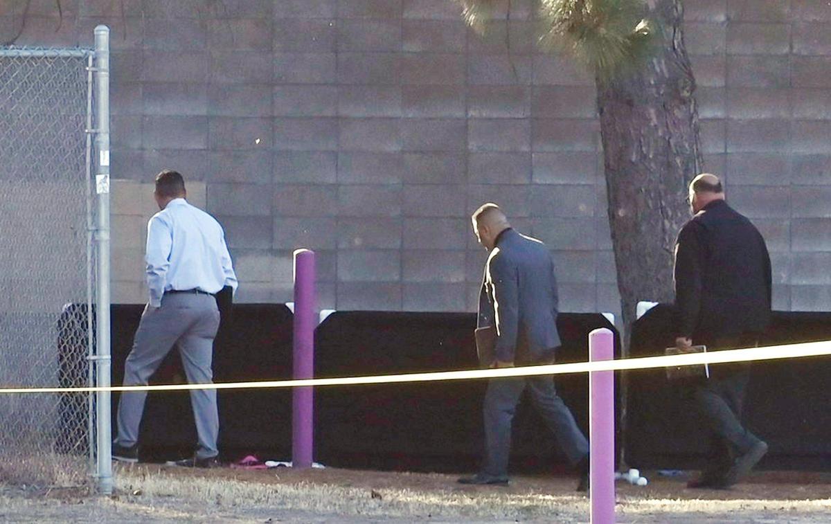 Investigators arrive behind Storyland in Roeding Park Thursday afternoon, Nov. 21, 2024 in Fresno. Police said a man died of a heart attack under suspicious circumstances.