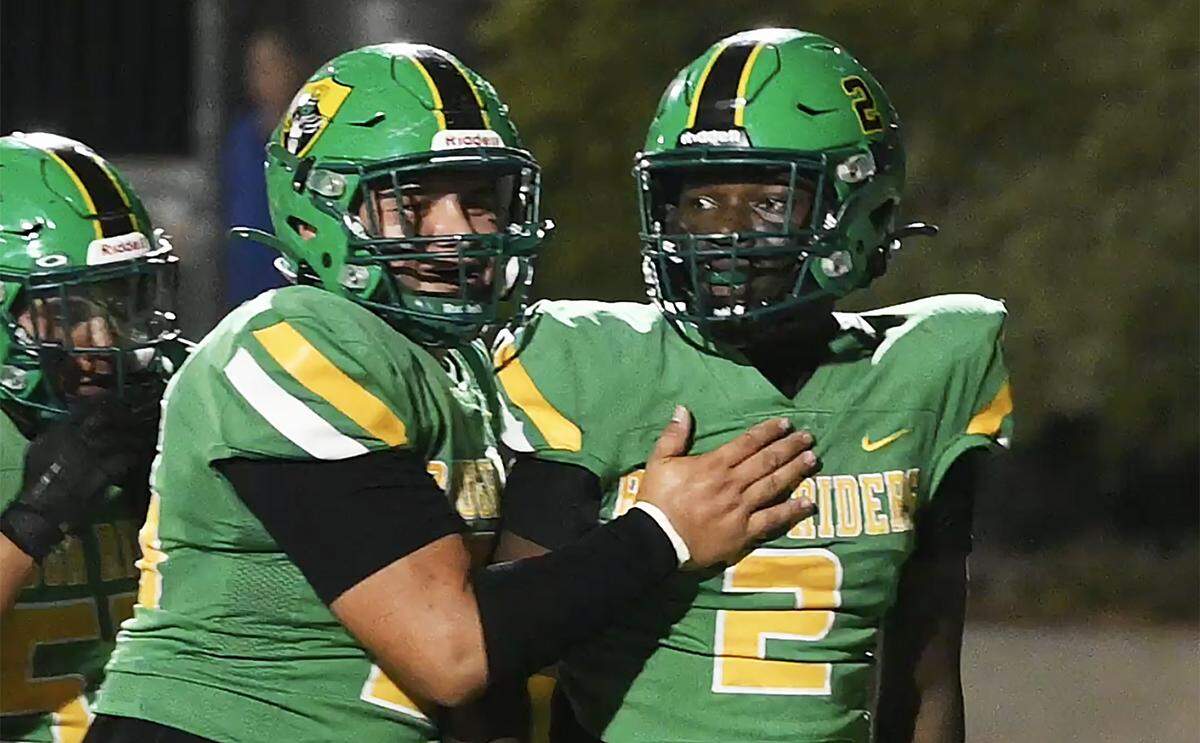 Roosevelt'running back Ehis Idoni, right, celebrates his touchdown against Firebaugh at Sunnyside's stadium Friday, Sept. 12, 2025 in Fresno. The Rough Riders pummeled the Eagles 46-6 with Firebaugh scoring their only touchdown in the final minutes of the game.