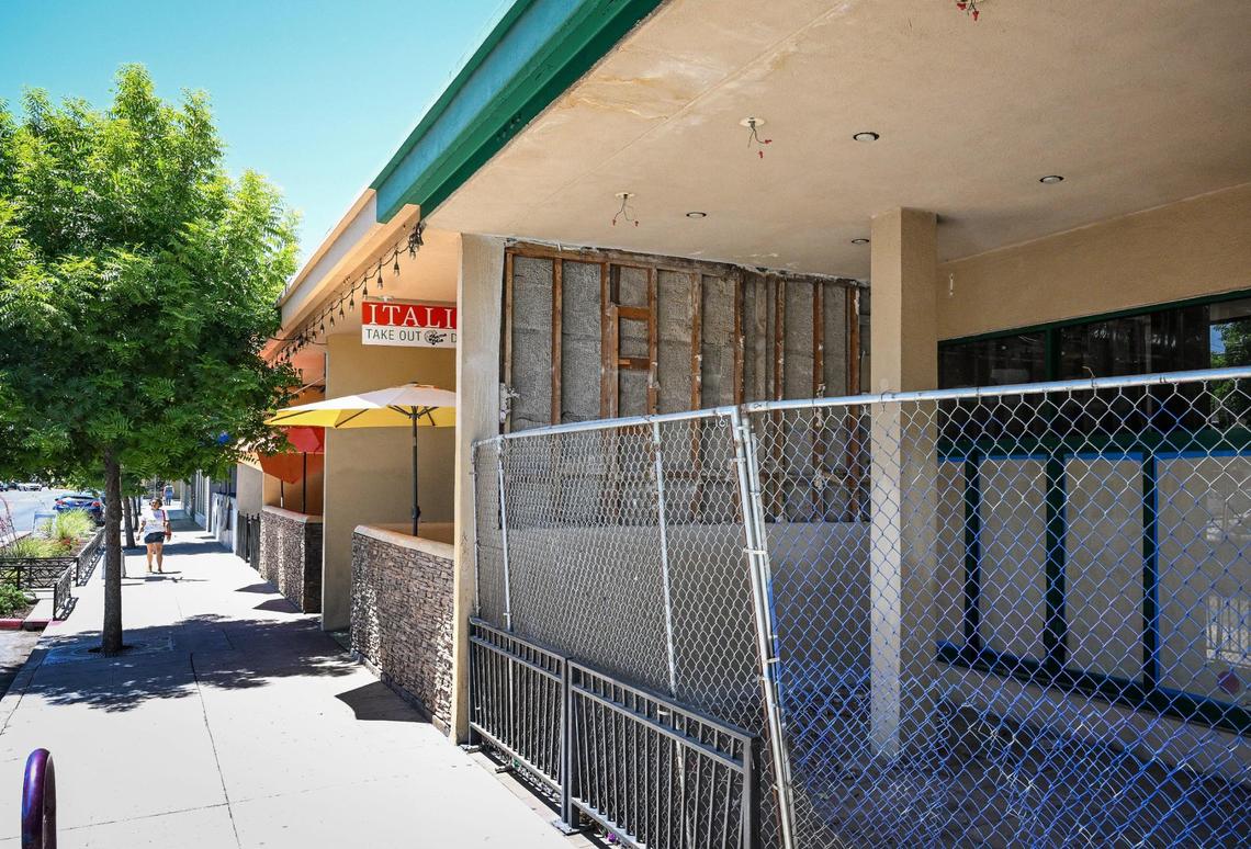 The space once occupied by Starbucks on Olive Avenue in the Tower District is still closed with a chain link fence covering the entrance. Starbucks closed the location during the coronavirus outbreak in 2020.