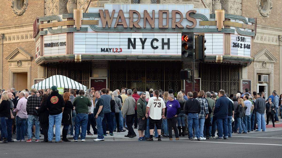 Fans wait to pick up their will call tickets outside Warnors Theatre on the first night of the Neil Young and Crazy Horse concert on Tuesday, May 1, 2018. Young and Crazy Horse last performed together in 2014.