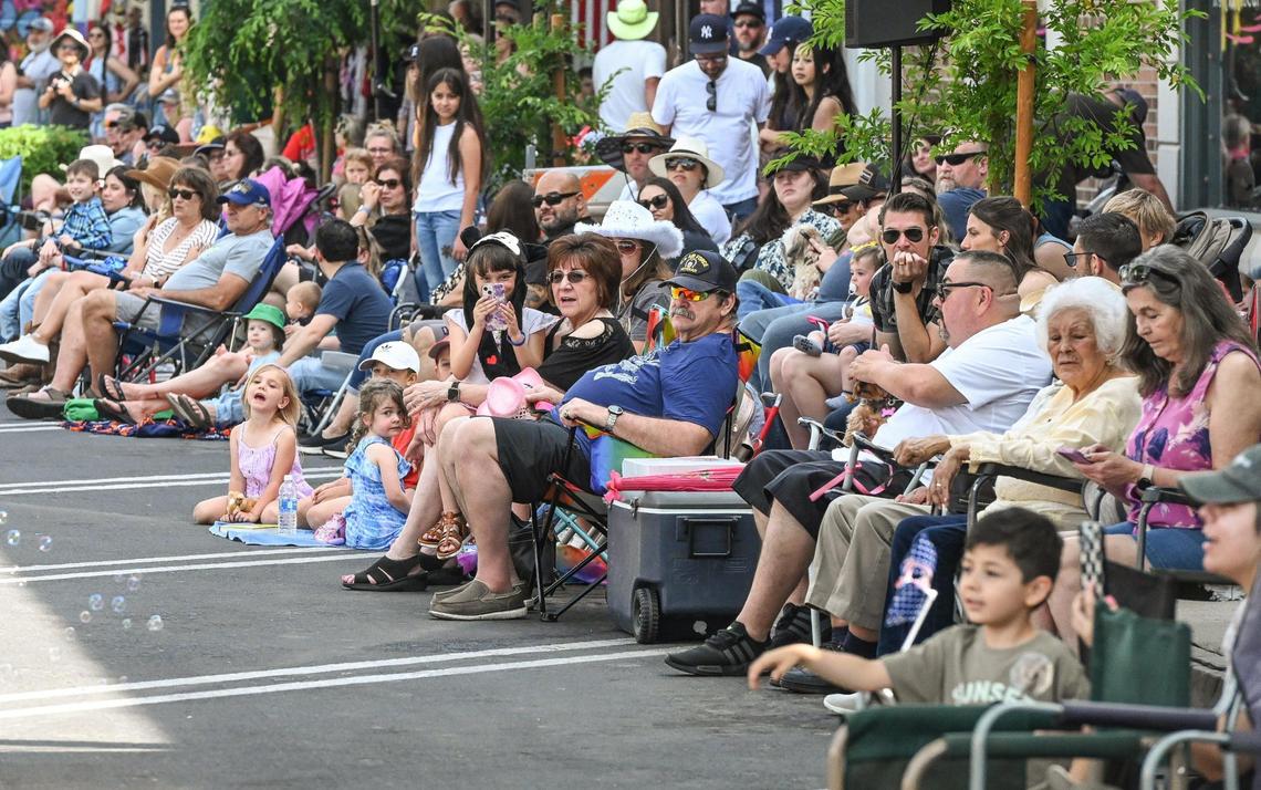 Parade-watchers crowd the streets of Pollasky Avenue in Old Town Clovis while watching entrants in the 109th annual Clovis Rodeo Parade on Saturday, April 29, 2023.