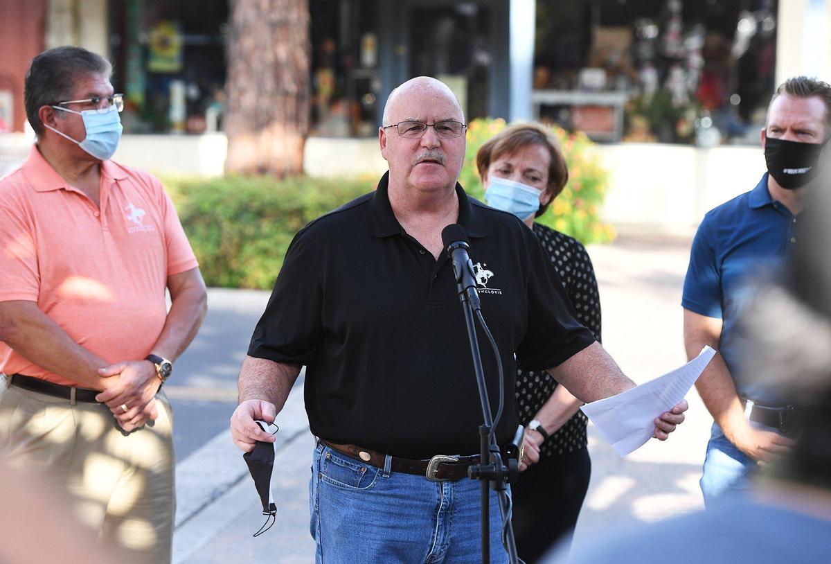 Clovis mayor Drew Bessinger, center, addresses the media from across the street after Chanel Wapner, owner of Just My Essentials, discovered racist vandalism at her shop Saturday, Sept 26, 2020, in Old Town Clovis.