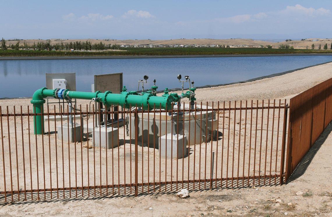 A large ponding basin, a water supply for Tesoro Viejo, background, seen Thursday, June 17, 2021 east of Madera Ranchos. Water is a critical source, compounded by housing developments in the area.