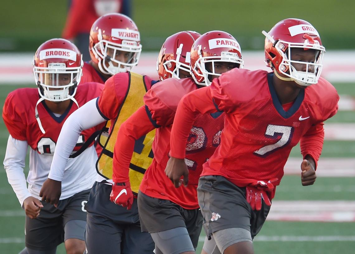 Fresno State wide receiver Derrion Grim, right, leads a group of wide receivers during practice Friday, March 15, 2019 in Fresno