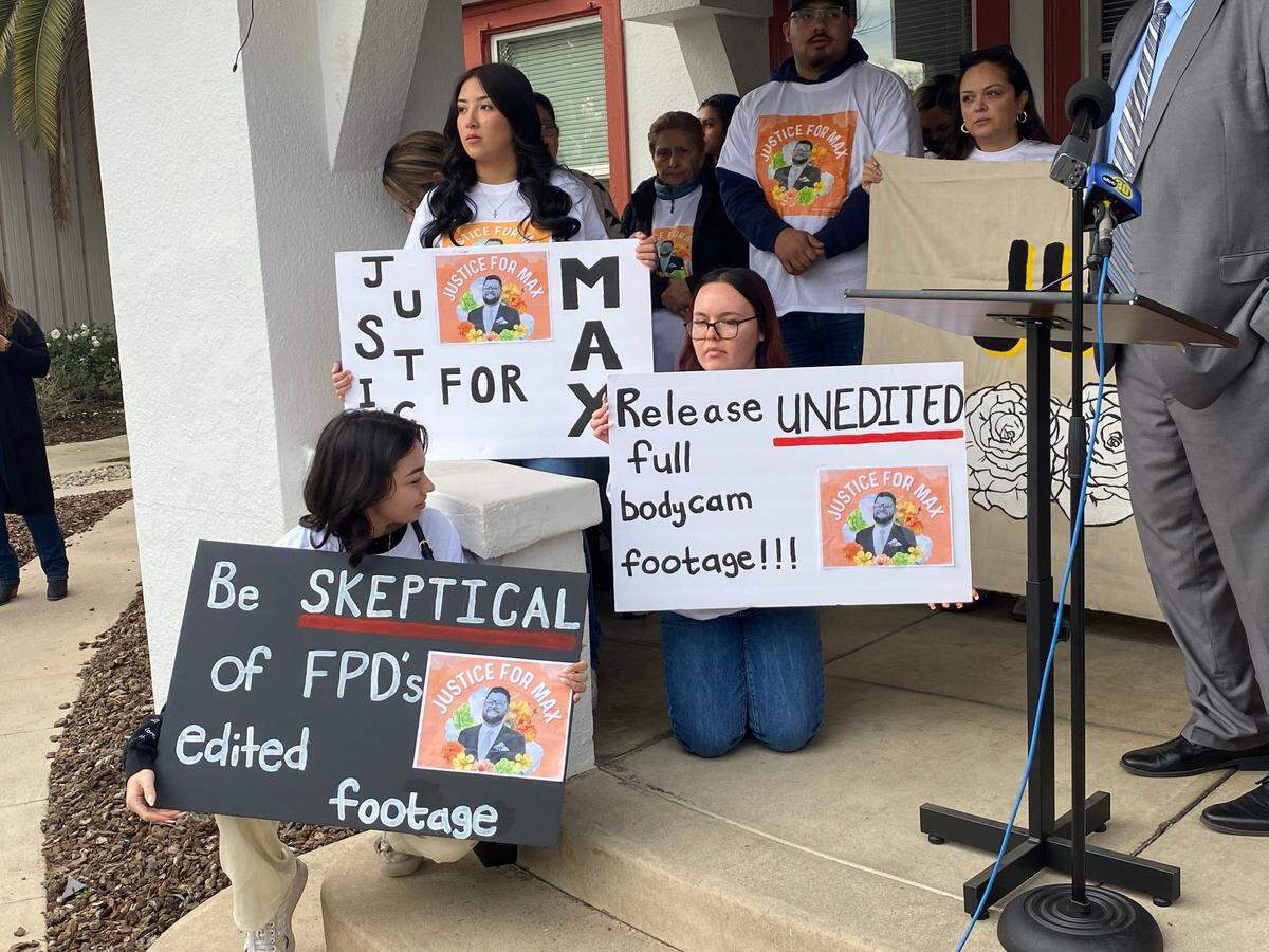 Family members and supporters on Friday, Jan. 12, 2024, hold signs during a news conference in which the decried the fatal shooting of Maximiliano “Max” Sosa Jr., 33, by Fresno police on Nov. 4, 2023.