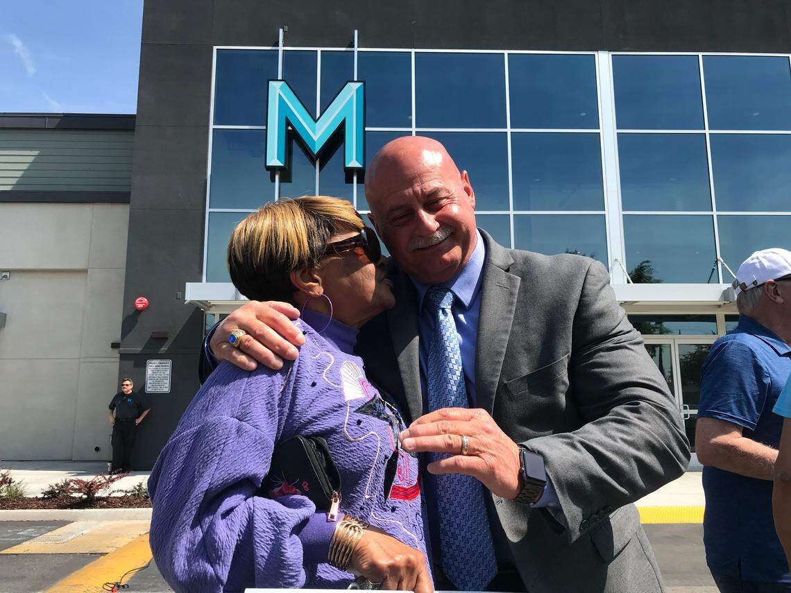 Audrey Redmond, left, hugs Fresno Police Chief Jerry Dyer before start of press conference in front or Manchester Center. Redmond worked with Americorp where she worked with Dyer, who formally announced his mayoral candidacy Wednesday.