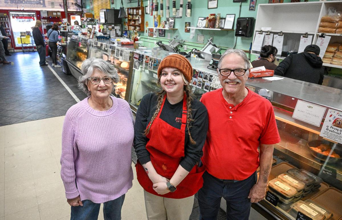 Piemonte’s Deli owners Nancy, left, and Neil Eberwein stand with manager Madison Lindsey Martinez, who, with her mother Jules, is in the process of purchasing the Tower District deli which the Eberweins have owned for 24 years.
