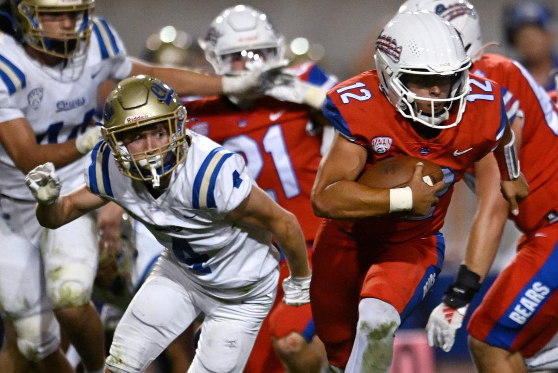 Clovis High’s Dalton Byrd, left, chases Buchanan quarterback Joshua Madrigal, right, Friday, Oct. 4, 2024 in Clovis. Clovis led Buchanan 14-3 at haltime.