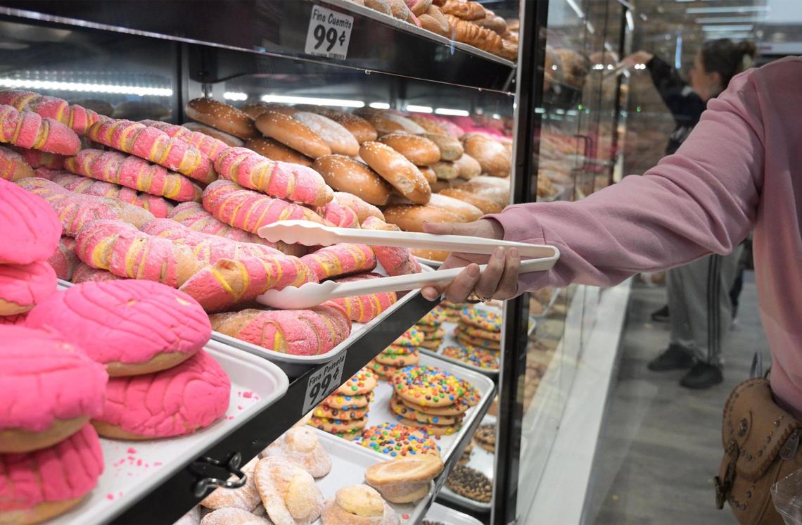 A shopper selects pan dulce at the panaderia inside the new Vallarta Supermarket on Shaw Avenue in Clovis in 2024. A new Vallarta is in the works for Visalia.