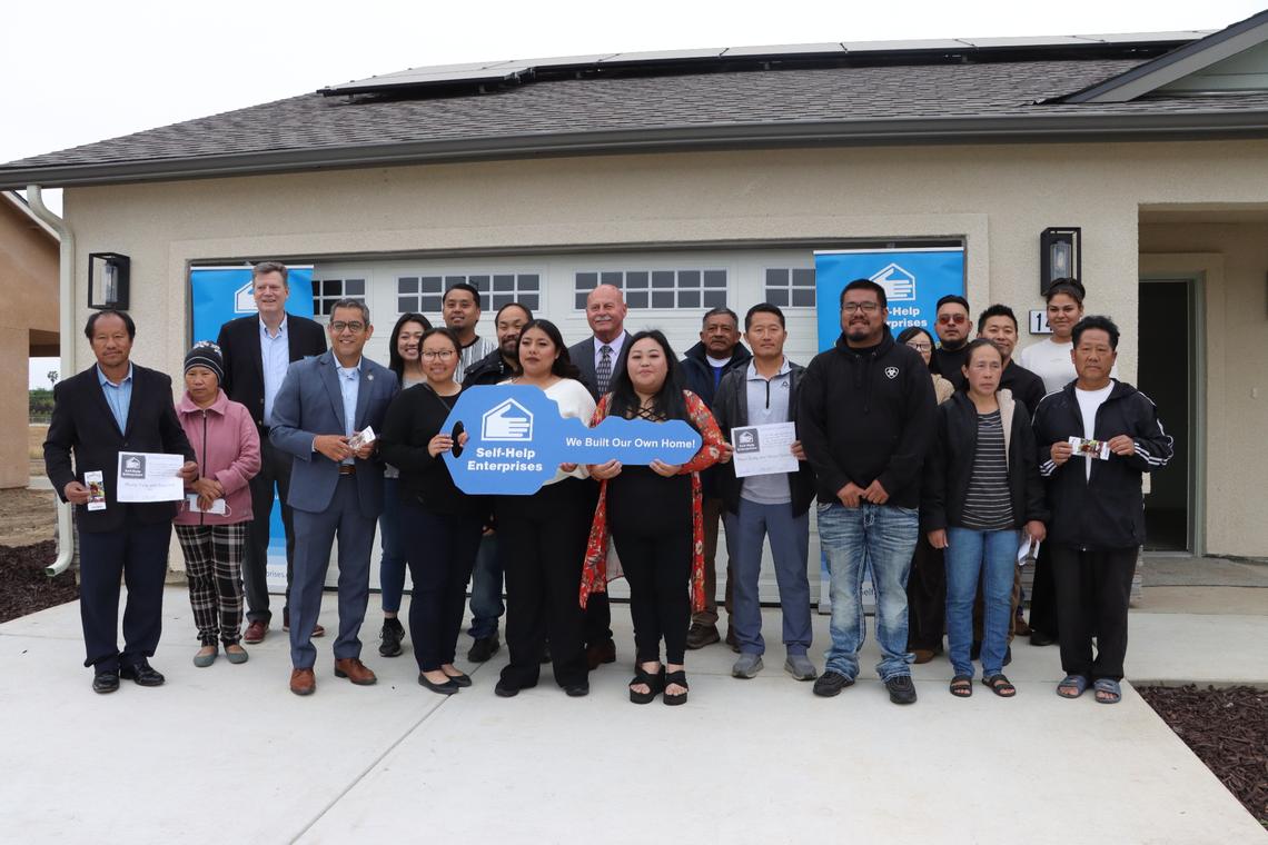 Esmeralda Melecio Lopez (center) and her brother were one of the 22 families in Southwest Fresno that on April 25 achieved homeownership after completing the construction of the home they built themselves thought the Mutual Self-Help Housing (MSHH) program, a program led by Self-Help Enterprises.