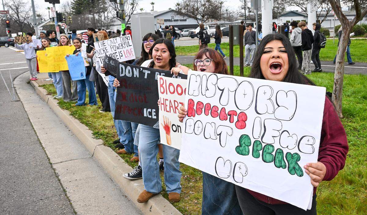 Students from Clovis Unified schools hold signs while protesting ICE enforcement on the corner of Shaw and Clovis avenues on Tuesday, Feb. 10, 2026. Several hundred students from area high schools and even Clark Intermediate were expected to attend the protest throughout the day. 