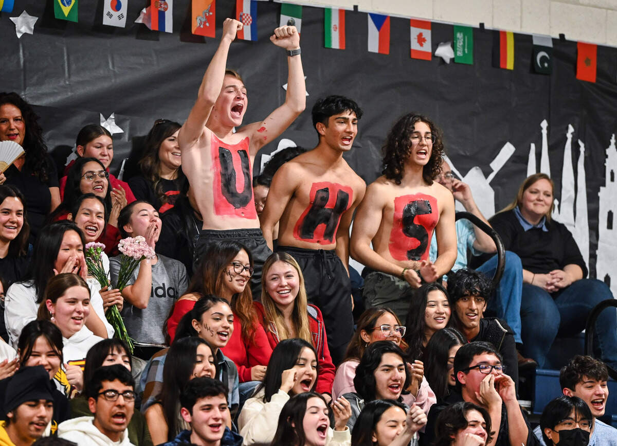 Shirtless University High School fans cheer on their Academic Decathlon team in the gymnasium at Sunnyside High School during the Super Quiz portion of the 42nd annual Fresno County Academic Decathlon on Saturday, Feb. 3 2024.