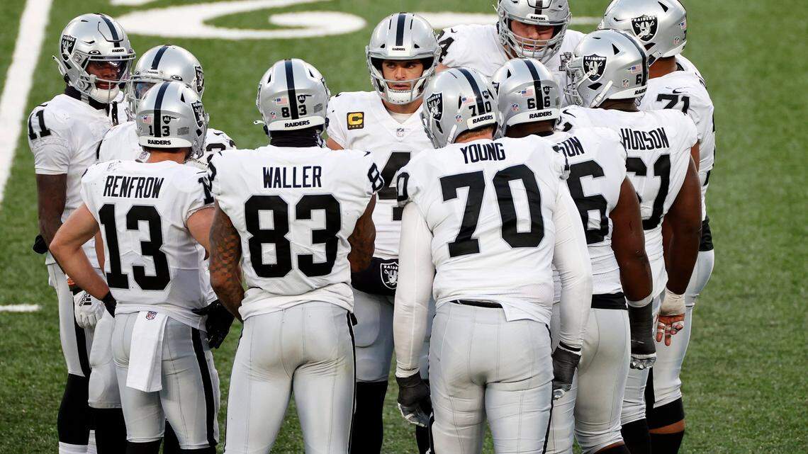 Las Vegas Raiders quarterback Derek Carr (4) in a team huddle during an NFL football game against the New York Jets, Sunday, Dec. 6, 2020, in East Rutherford, N.J.