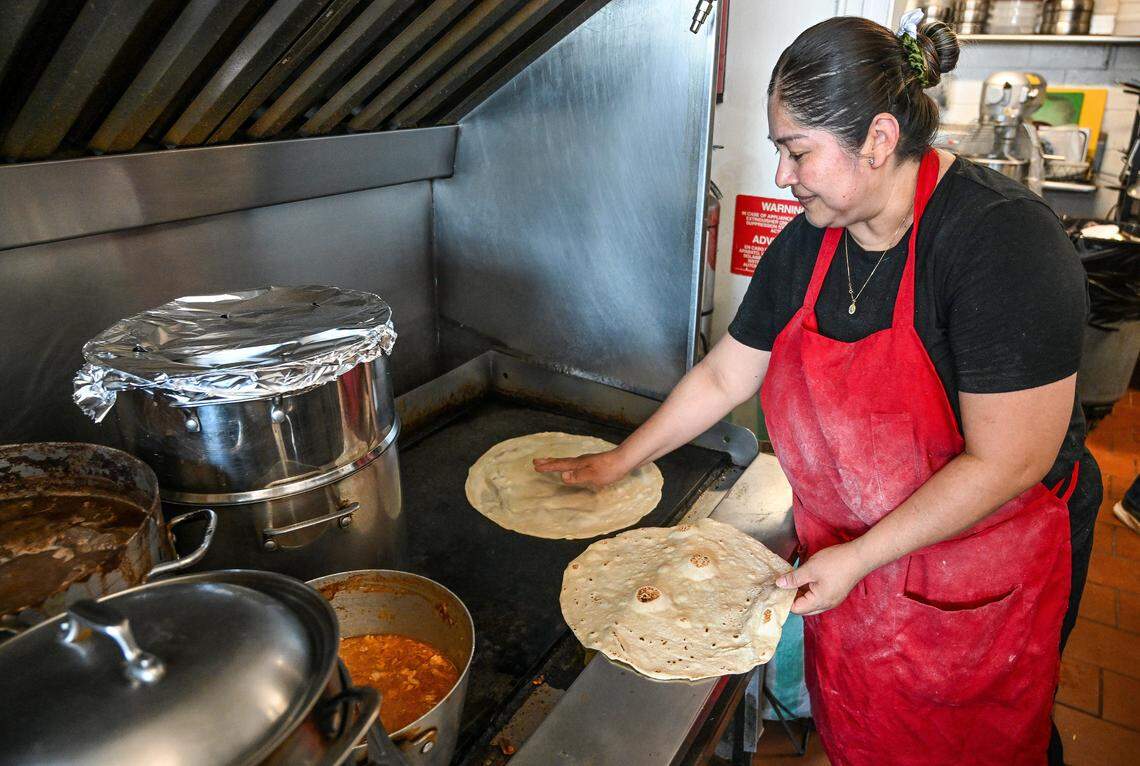 Eineida Mendes cooks homemade tortillas on the grill at Adrian’s, a longtime Fresno Mexican food stop at Belmont Avenue near First Street on June 24, 2024.