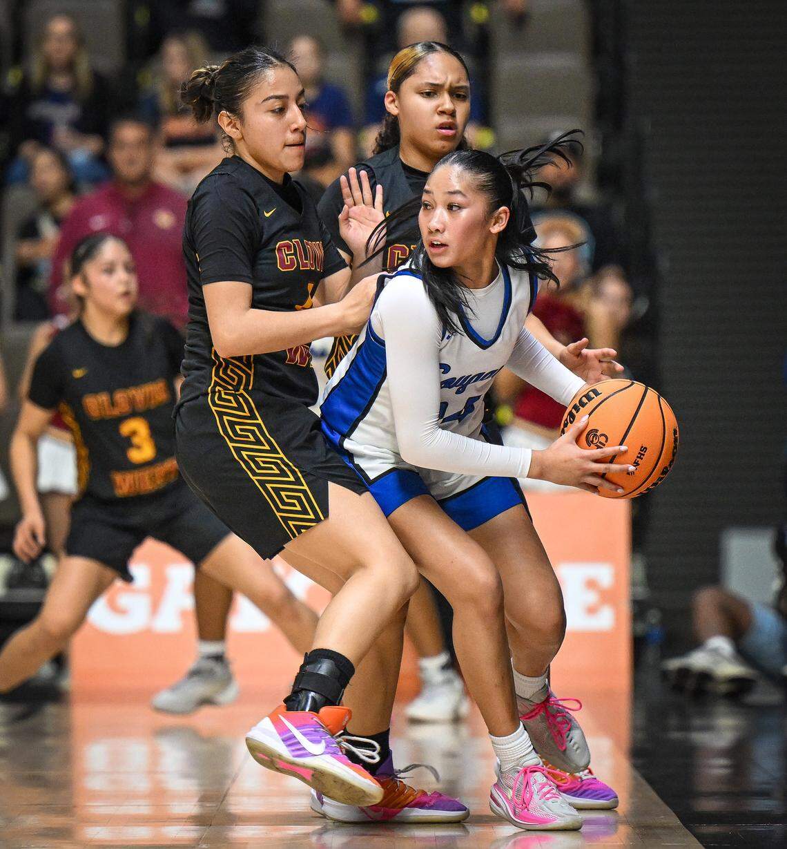 Clovis West's Josline Martinez, left, and McKenna Curry trap Clovis' Sadie Sin during their Central Section Division 1 girls basketball championship game at Selland Arena on Saturday, Feb. 28, 2026. 