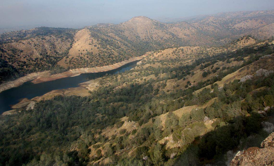 This is a view to the north over the edge of Big Table Mountain into the gorge containing the upper reaches of Millerton Lake near Temperance Flat. The proposed Temperance Flat dam would be constructed roughly where the lake is obscured by the ridge coming in from the right.
