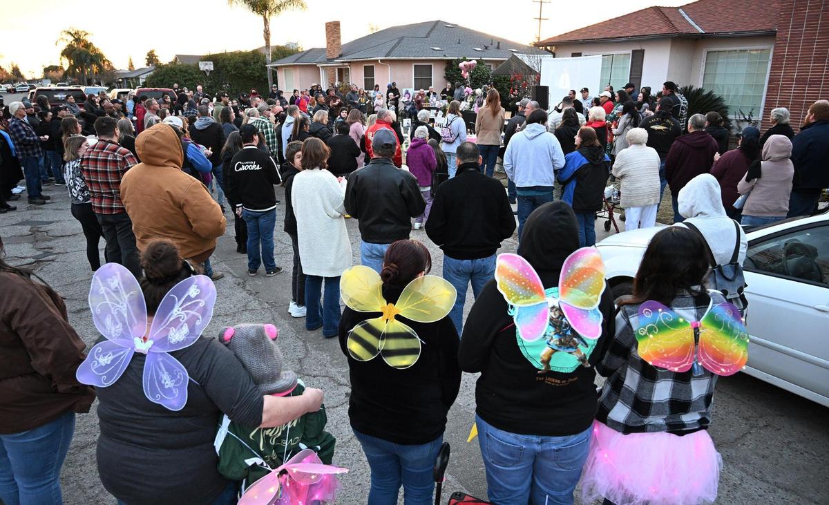 Hundreds gather for a candlelight vigil days after the murder of four Bond family members Friday evening, Jan. 12, 2024 in Reedley.
