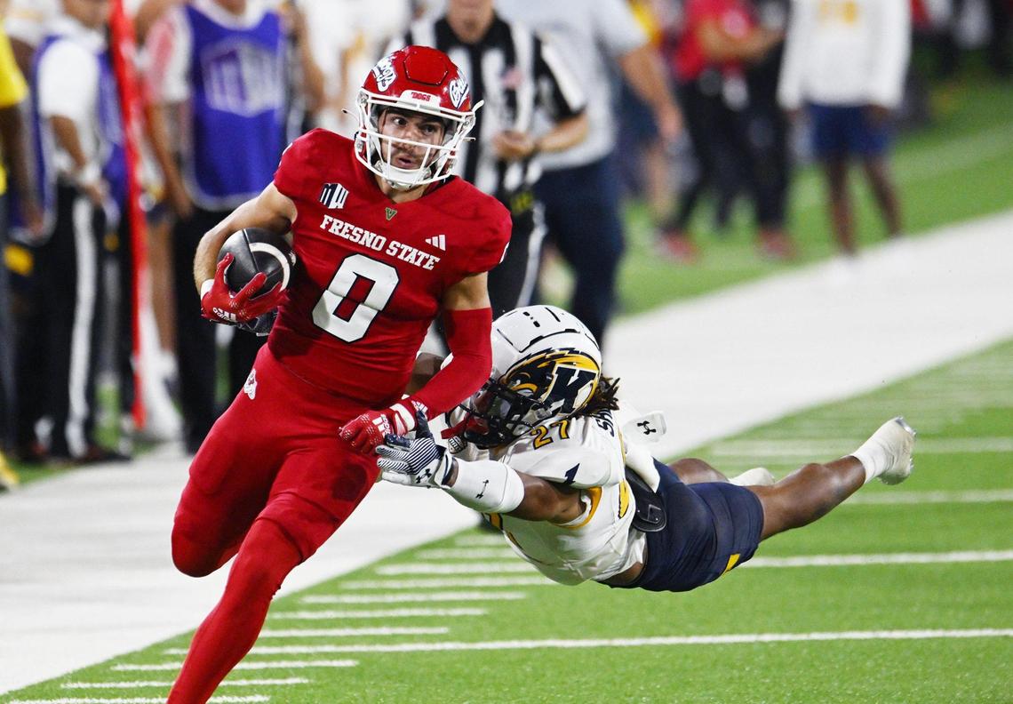 Fresno State’s Mac Dalena run outruns Kent State’s Bryce Sheppert, right, Saturday, Sept. 23, 2023 in Fresno.