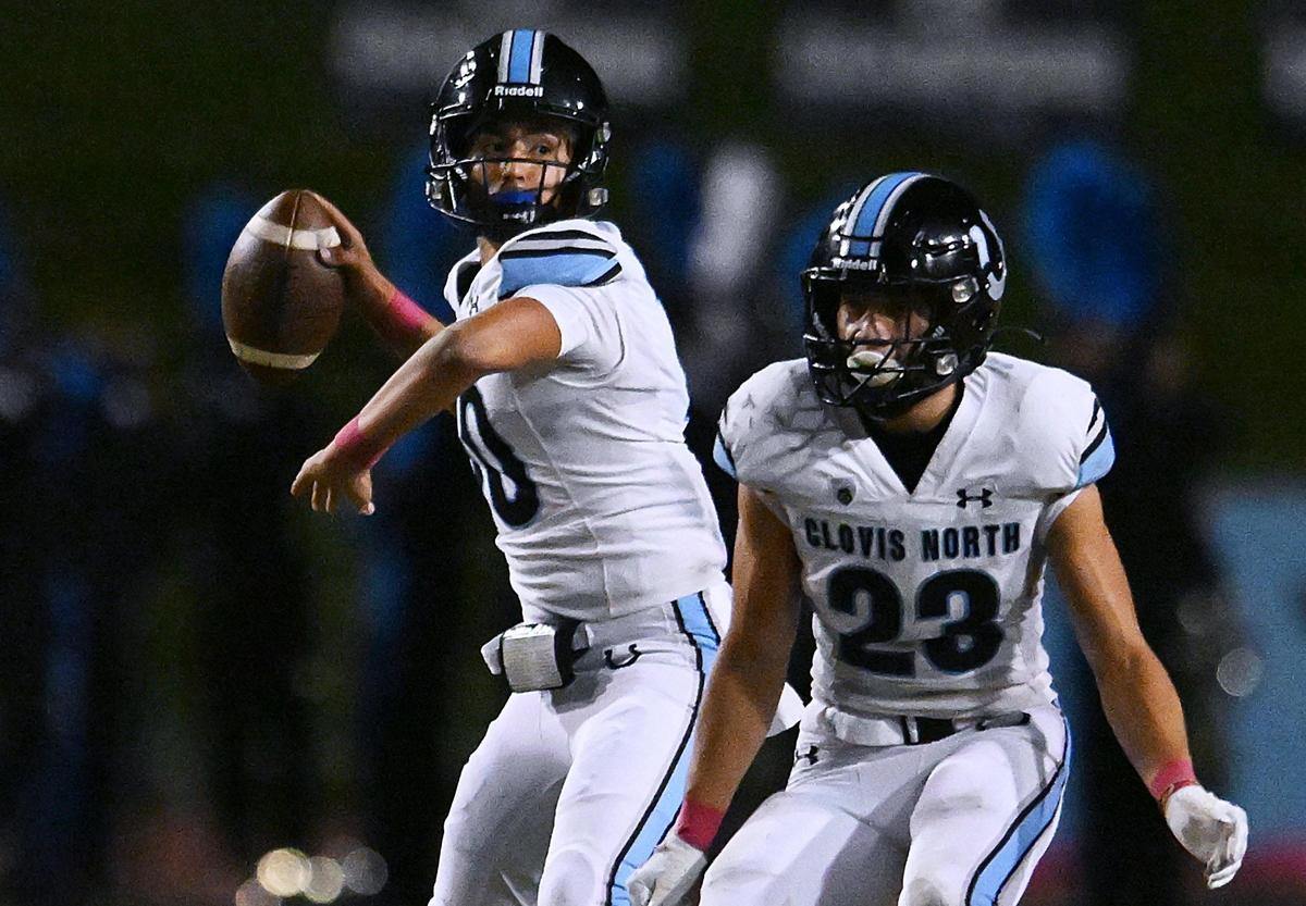 Clovis North quarterback Mario Cosma looks downfield to pass against Clovis West on Friday, Oct. 13, 2023, in Clovis.