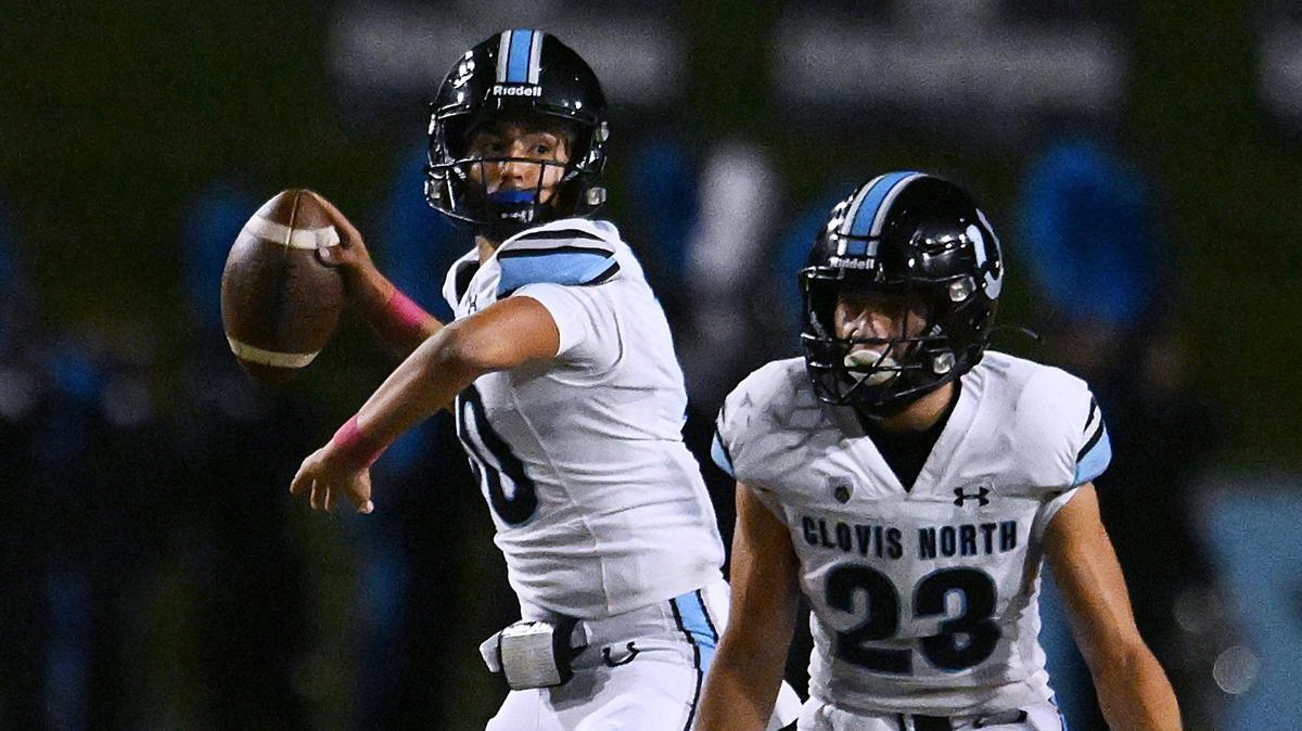 Clovis North quarterback Mario Cosma, left, looks downfield to pass against Clovis West Friday, Oct. 13, 2023 in Clovis.