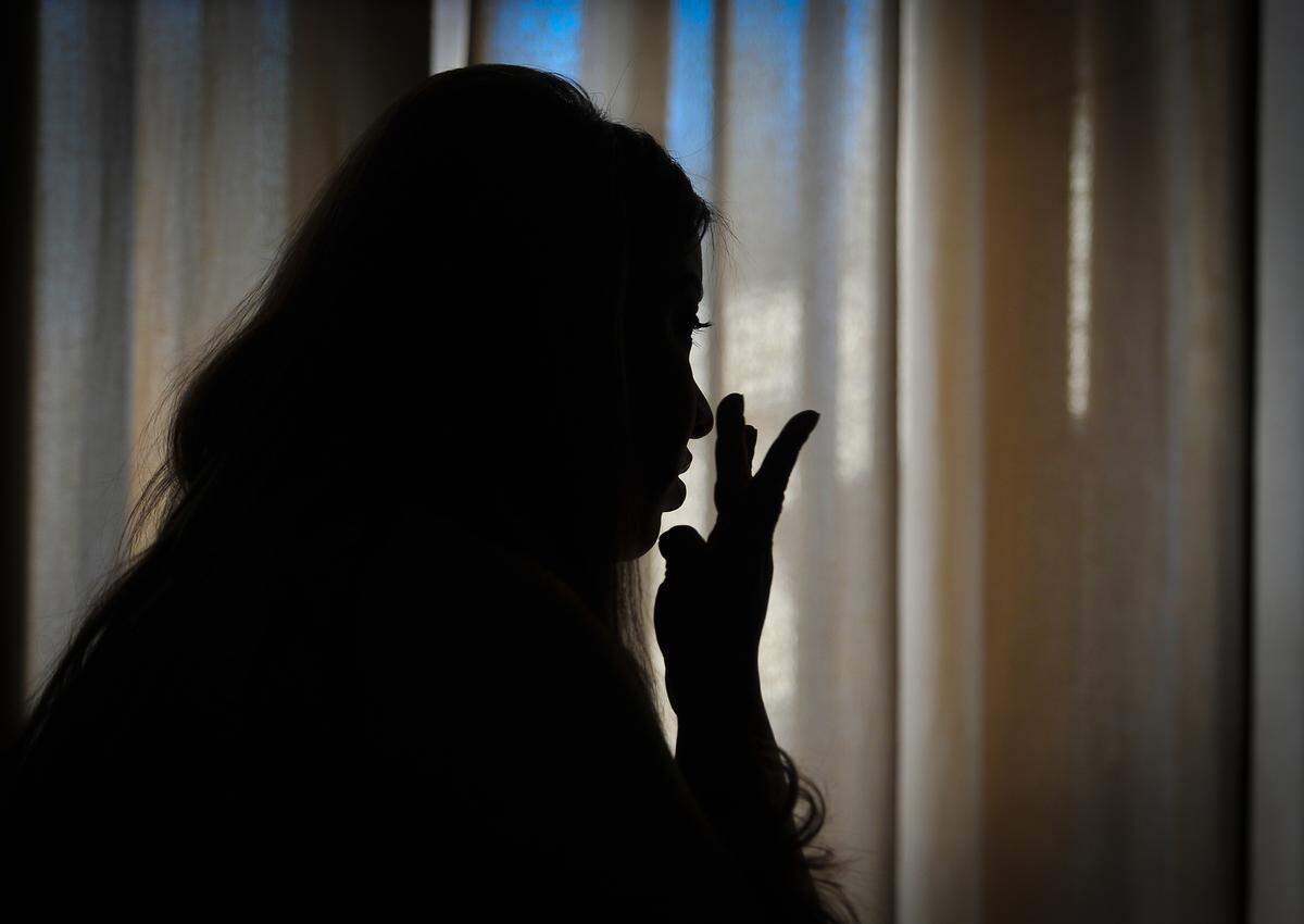 Jannette Maya wipes away a tear talking about her sister, Joanna Maya, who was murdered July 13, 2016, allegedly by the MS-13 gang in Mendota.