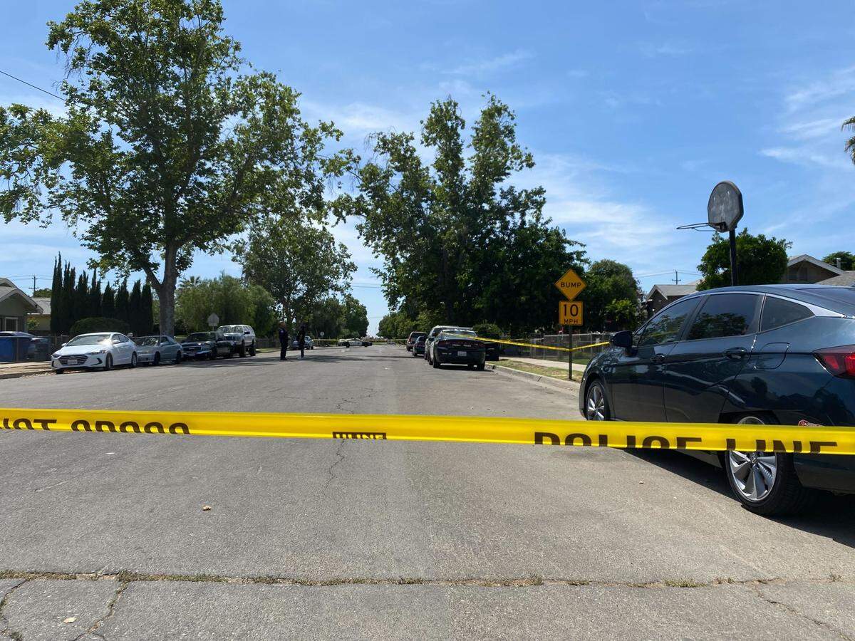 Police investigate a shooting in a neighborhood near Kearney Boulevard and Thorne Avenue in west Fresno, California, on Wednesday, May 18, 2022.